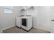 Convenient laundry room with washer and dryer at 8861 Forge Breeze Loop, Wesley Chapel, FL 33545