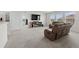 Spacious living room with two recliners and fireplace at 8861 Forge Breeze Loop, Wesley Chapel, FL 33545