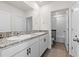 Double vanity bathroom with granite countertop at 8861 Forge Breeze Loop, Wesley Chapel, FL 33545