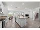 Modern kitchen with granite countertops and stainless steel appliances at 8861 Forge Breeze Loop, Wesley Chapel, FL 33545