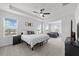 Spacious Primary bedroom with large windows and plush carpeting at 8861 Forge Breeze Loop, Wesley Chapel, FL 33545