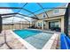 Large pool and spa with screened enclosure, and backyard views at 8861 Forge Breeze Loop, Wesley Chapel, FL 33545