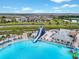 Expansive lagoon pool with waterslide and kayak rentals at 8861 Forge Breeze Loop, Wesley Chapel, FL 33545