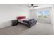 Spacious bedroom with a double bed and window at 8861 Forge Breeze Loop, Wesley Chapel, FL 33545