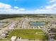 Aerial view of community featuring a lake and various houses at 8861 Forge Breeze Loop, Wesley Chapel, FL 33545