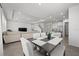 Open dining area with a six-seat table and view into the living room at 8861 Forge Breeze Loop, Wesley Chapel, FL 33545