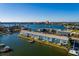 Aerial view of waterfront condo building with boats and beautiful water views at 1893 Shore S Dr # 215, South Pasadena, FL 33707