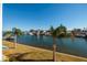 Stunning view of the canal with lush landscaping and boats at 1893 Shore S Dr # 215, South Pasadena, FL 33707