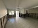 Spacious living room with orange couch and decorative plants at 2704 2Nd St # 7, Indian Rocks Beach, FL 33785
