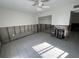 Renovation in progress: bedroom with exposed framing, new tile flooring, and AC unit at 2704 2Nd St # 7, Indian Rocks Beach, FL 33785