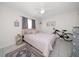 Bedroom with a queen bed, bicycle, and a decorative rug at 2704 2Nd St # 7, Indian Rocks Beach, FL 33785