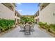 Courtyard with seating area and tropical landscaping at 2704 2Nd St # 7, Indian Rocks Beach, FL 33785