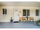 Condo entryway with seating area and potted plants at 2704 2Nd St # 7, Indian Rocks Beach, FL 33785