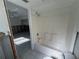 Bathroom with a bathtub and a view into another room at 2704 2Nd St # 7, Indian Rocks Beach, FL 33785