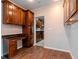 Eat-in kitchen with wood cabinets and granite countertops at 3907 W Bay Vista Ave, Tampa, FL 33611