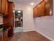 Eat-in kitchen with wood cabinets and granite countertops at 3907 W Bay Vista Ave, Tampa, FL 33611