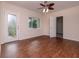 Bright living room features hardwood floors and a brick fireplace at 3907 W Bay Vista Ave, Tampa, FL 33611