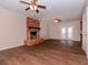 Living room with hardwood floors, fireplace, and access to backyard at 3907 W Bay Vista Ave, Tampa, FL 33611