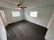 Bedroom with ceiling fan and two windows at 12026 Boynton Ln # Gb32, New Port Richey, FL 34654