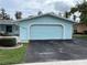 Condo exterior with carport and landscaping at 12026 Boynton Ln # Gb32, New Port Richey, FL 34654