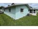 Light teal home exterior with well-maintained lawn at 12026 Boynton Ln # Gb32, New Port Richey, FL 34654