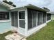Enclosed Florida room addition with glass windows and door at 12026 Boynton Ln # Gb32, New Port Richey, FL 34654