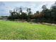 Serene pond view with lush greenery and mature trees at 12026 Boynton Ln # Gb32, New Port Richey, FL 34654