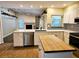 Updated kitchen with island and butcher block countertop at 3582 Fairway Forest Dr, Palm Harbor, FL 34685