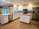 Modern kitchen with white cabinets, stainless steel appliances, and quartz countertops at 3582 Fairway Forest Dr, Palm Harbor, FL 34685