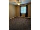 Spacious bedroom with carpeted floor and ceiling fan at 3582 Fairway Forest Dr, Palm Harbor, FL 34685