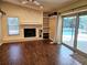 Living room featuring a stone fireplace and dark wood floors at 3582 Fairway Forest Dr, Palm Harbor, FL 34685