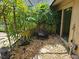 Landscaped garden with a serene water fountain at 3582 Fairway Forest Dr, Palm Harbor, FL 34685