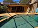 Large, inviting pool with extended patio and spa at 3582 Fairway Forest Dr, Palm Harbor, FL 34685