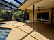Spacious patio adjacent to the pool and house at 3582 Fairway Forest Dr, Palm Harbor, FL 34685