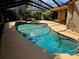 Inviting screened pool area with spa and ample deck space at 3582 Fairway Forest Dr, Palm Harbor, FL 34685