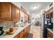 Kitchen boasts granite countertops and ample wood cabinets at 250 Rosery Nw Rd # 351, Largo, FL 33770