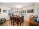 Cozy dining area with a square table and farmhouse-style decor at 250 Rosery Nw Rd # 351, Largo, FL 33770