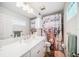 Bathroom features a white vanity and a stylish shower curtain at 250 Rosery Nw Rd # 351, Largo, FL 33770