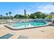 Refreshing community pool with surrounding lounge chairs at 250 Rosery Nw Rd # 351, Largo, FL 33770