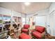 Bright sunroom featuring comfortable wicker chairs and access to outdoors at 250 Rosery Nw Rd # 351, Largo, FL 33770
