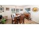 Farmhouse-style dining room with wooden table and charming decor at 250 Rosery Nw Rd # 351, Largo, FL 33770
