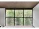 Screened balcony overlooking wooded area at 1400 Tarpon Woods Blvd # B5, Palm Harbor, FL 34685