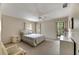 Bedroom with dresser and ensuite bathroom at 1400 Tarpon Woods Blvd # B5, Palm Harbor, FL 34685