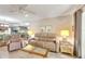 Spacious living room with comfortable seating and hardwood floors at 1400 Tarpon Woods Blvd # B5, Palm Harbor, FL 34685