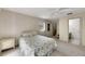 Bright bedroom with a comfortable bed and ensuite bathroom at 1400 Tarpon Woods Blvd # B5, Palm Harbor, FL 34685