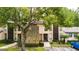 Condo building with stone accents and landscaping at 1400 Tarpon Woods Blvd # B5, Palm Harbor, FL 34685