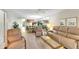 Relaxing living room featuring a large sectional sofa and ample natural light at 1400 Tarpon Woods Blvd # B5, Palm Harbor, FL 34685