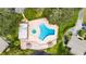 Community pool and spa with surrounding landscaping and patio at 1400 Tarpon Woods Blvd # B5, Palm Harbor, FL 34685