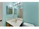 Bathroom with double vanity and mirrored medicine cabinet at 1400 Tarpon Woods Blvd # B5, Palm Harbor, FL 34685