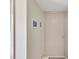 Light and airy entryway with a beige door and nautical-themed artwork at 1400 Tarpon Woods Blvd # B5, Palm Harbor, FL 34685